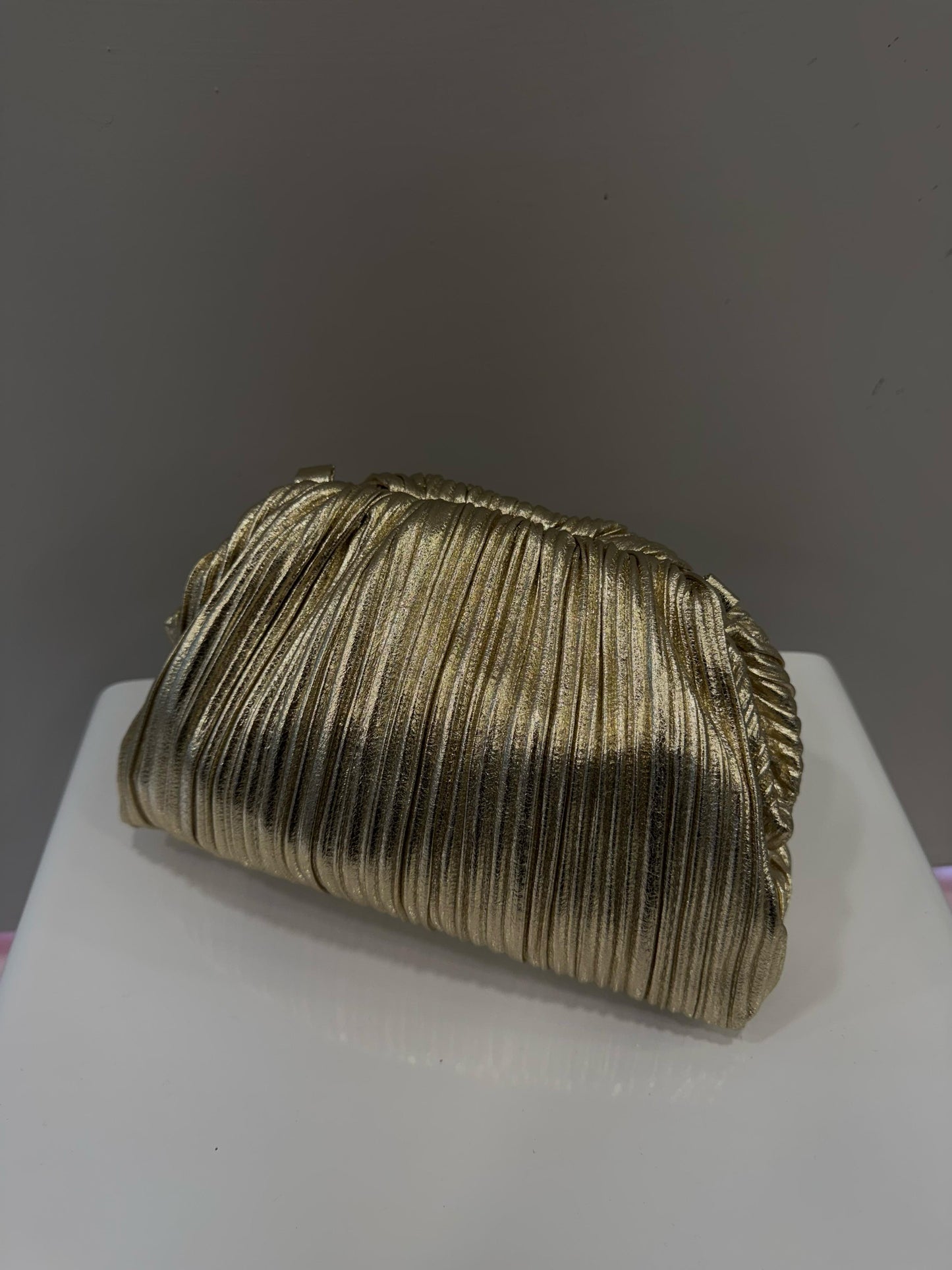 clutch oro laminata
